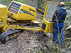 Manoeuvrable grinder grinding tree stump